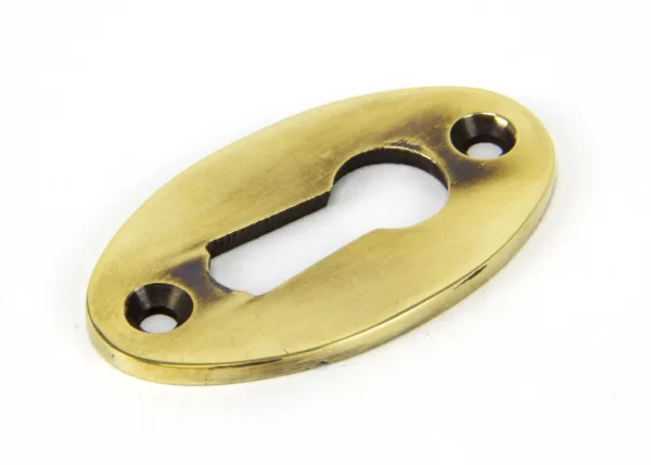 From The Anvil Aged Brass Oval Escutcheon